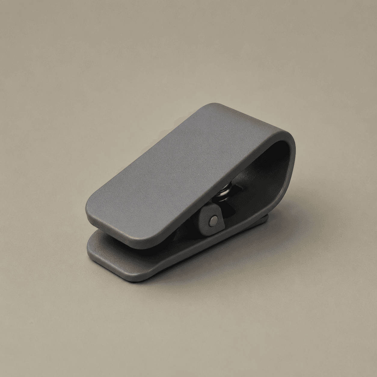 Matte grey spring receipt clip, studio shot