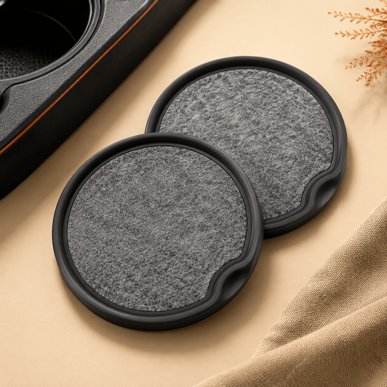 Two grey absorbent cup holder coasters, studio shot