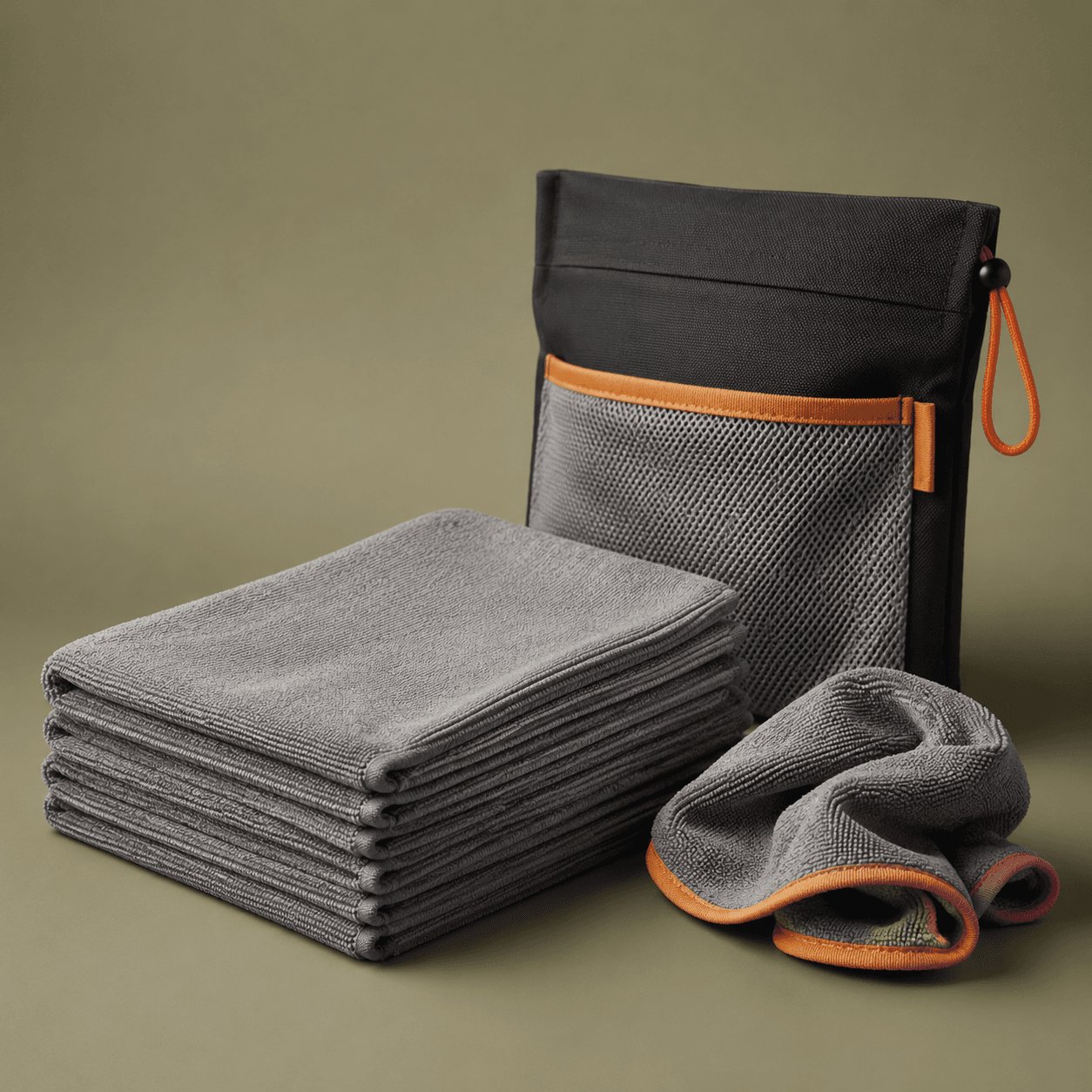 Folded stack of grey microfibre cloths, studio shot